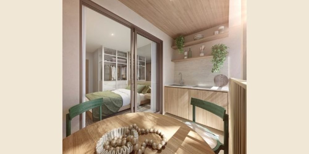 Guilhem Mozak Leblon - Área de lazer interna com sofás, estantes e iluminação embutida, projetada para conforto e convivência elegante.