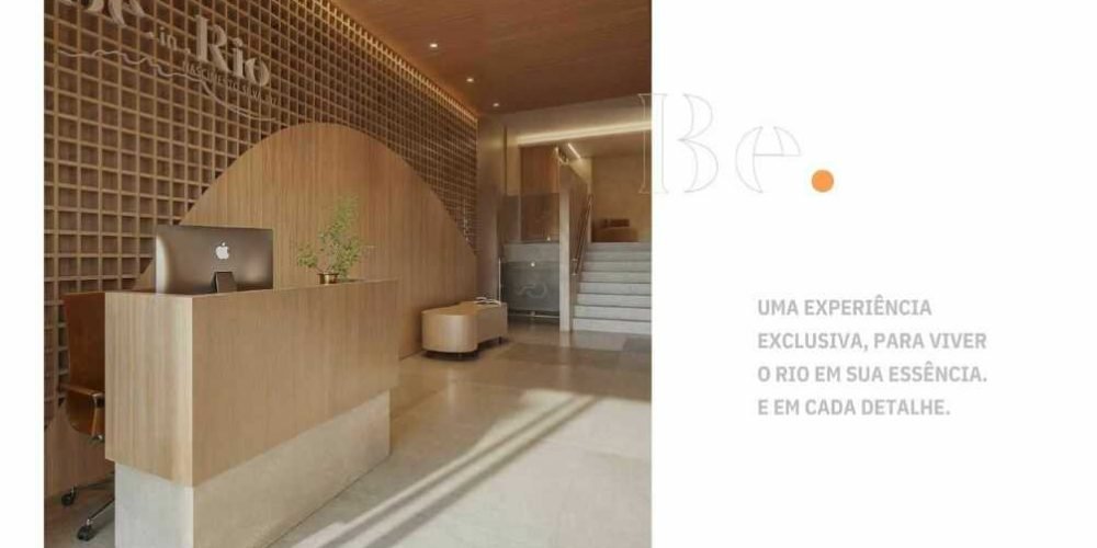 Hall de entrada do Be In Rio Nascimento Silva 387 com recepção sofisticada em madeira e design contemporâneo.