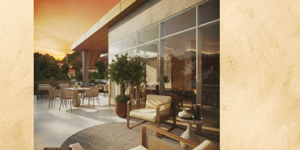 Lounge externo do Céu Laranjeiras com mobiliário moderno e vista para o pôr do sol em Laranjeiras, perfeito para momentos de relaxamento.