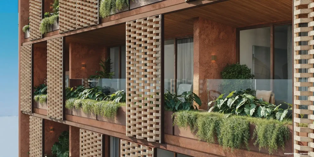 Detalhe da fachada do Mare Ipanema com brises vazados, vegetação integrada e acabamento em tons terrosos, mostrando a estética assinada por Bernardes Arquitetura.