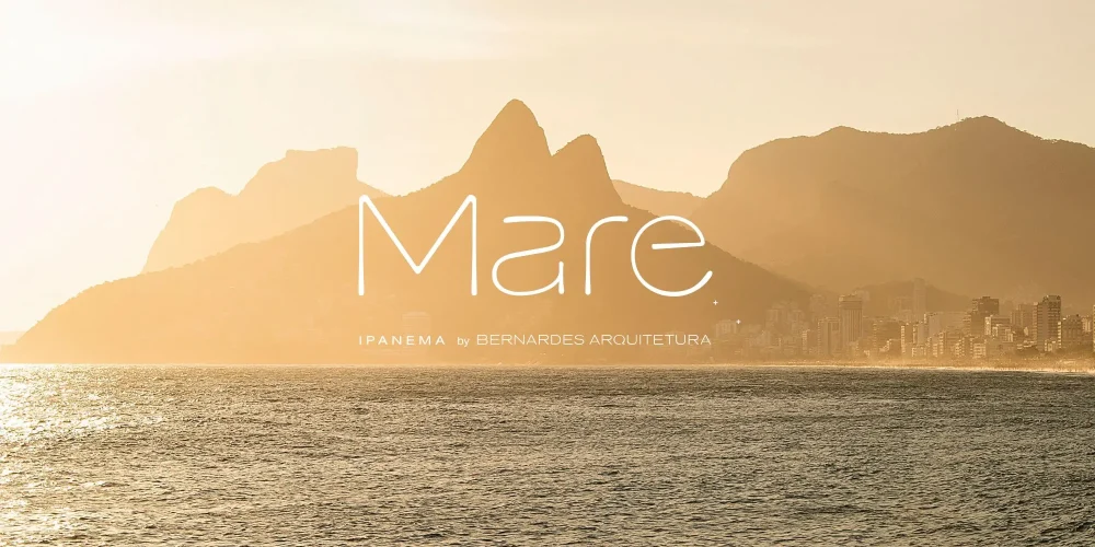 Fachada visual do Mare Ipanema com vista para o Morro Dois Irmãos ao pôr do sol, identidade do empreendimento assinada por Bernardes Arquitetura.