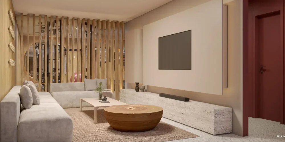 Sala de TV do Sal Praia de Ipanema com sofá em L, painel minimalista e decoração em madeira.